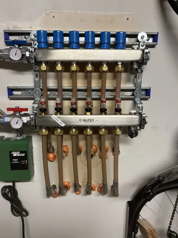 Plumber performing Water Heater Repair at a residential property in Frankford